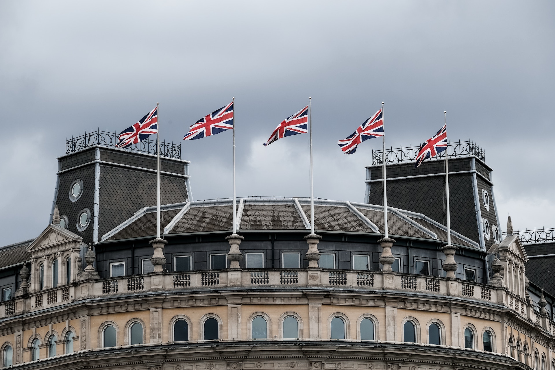 row of England flags on top of a building